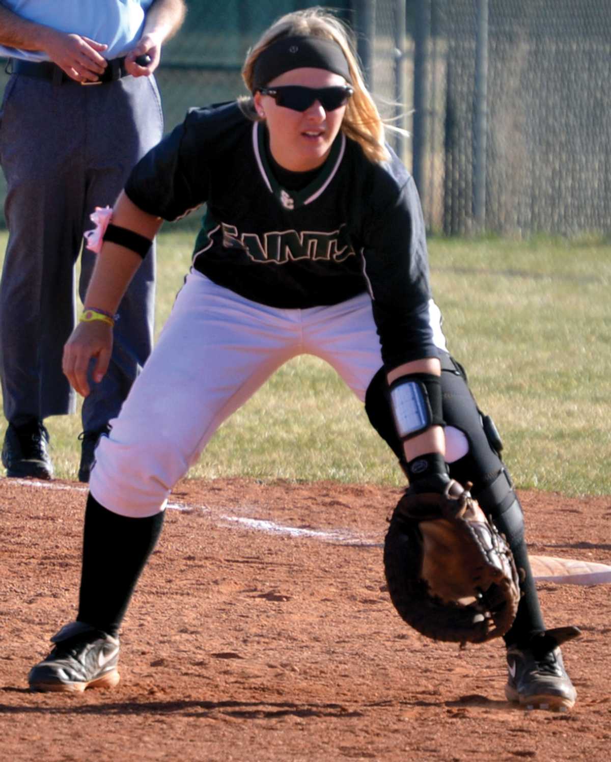 Crusader photo/Jose Medrano
Lady Saint Stephanie Mark stands at first base waiting for a hit during the Jayhawk West conference opener against Butler on March 6 at home.