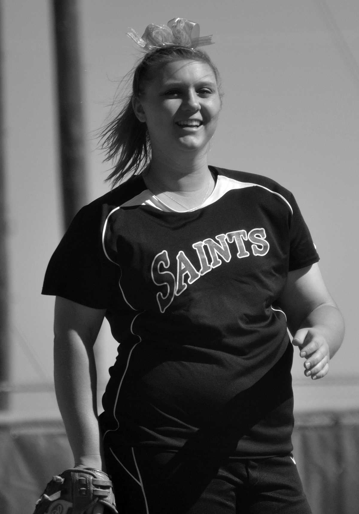 Crusader photo/Jakub Stepanovic
Katelyn Craker warms up before the inning begins in Monday’s game against McCook. The Lady Saints swept the double header 5-1 and 11-0.  The Lady Saints current overall standings are 17-4. 