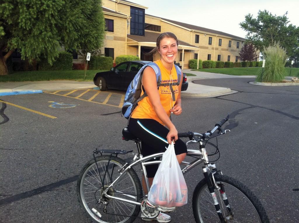 Rochelle St. Amand, who recently moved to Liberal, returns from a bike ride to Wal-Mart to purchase groceries.