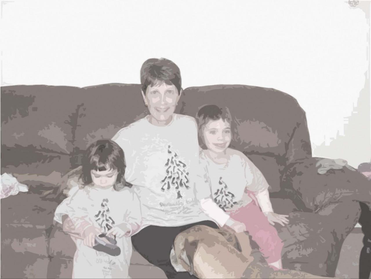  Seward Dean of Instruction Cynthia Rapp sits with granddaughters Afton Lemmon, left,  and Caitlin Lemmon. The family had 
participated in a walk as part of April’s Autism Awareness Month. Caitlin, 5, is 
diagnosed with autism. But 
surrounded by 
family members such as Rapp, 
sister Afton and pooch Vinnie, 
along with 
doctors, she’s 
making strides.  Autism affects  about one in 110 births.The background is a drawing by Caitlin featured on a Christmas card for Alpine Autism Center.
Photo illustration