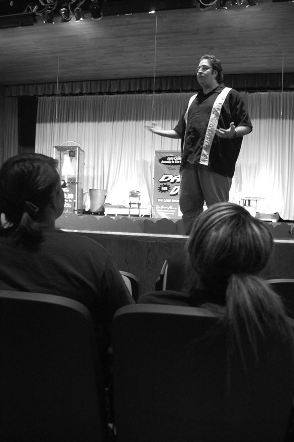 Students watch as the Dash for Dollars host explains the rules of the game. Although students attended the Dash for Dollars event, the majority of the seats were empty.

Crusader photo/ Morgan Allaman