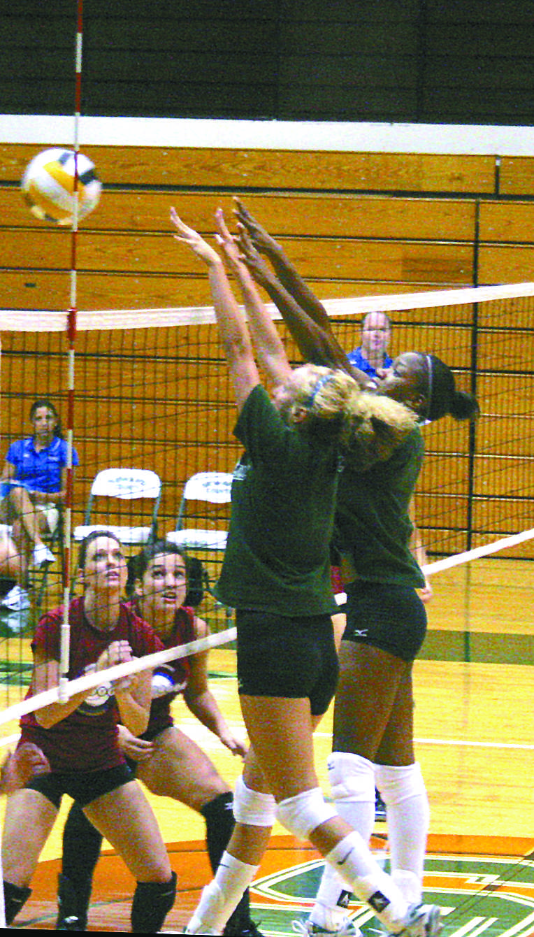 Crusader photo/ Chris “Turtle” Flowers
Lindsey Miller and LaKendra Sanders go up for a block during the scrimmage against the Oklahoma Panhandle State University Aggies.