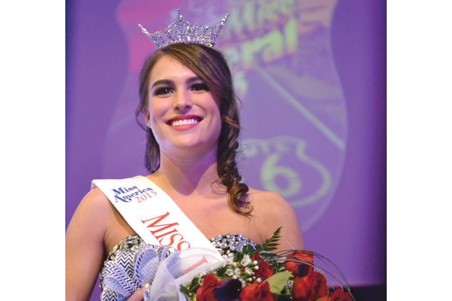 Crusader photo/ Diana Chavira
Allyson Nondorf smiles to her fans in the audience as she makes her way across the stage after being crowned Miss Liberal 2015. Nondorf also received the Quality of Life Award $500 scholarship, and tied with contestant Lexie Kilbourne in lifestyle and fitness swimwear and was voted as the Peoples Choice.