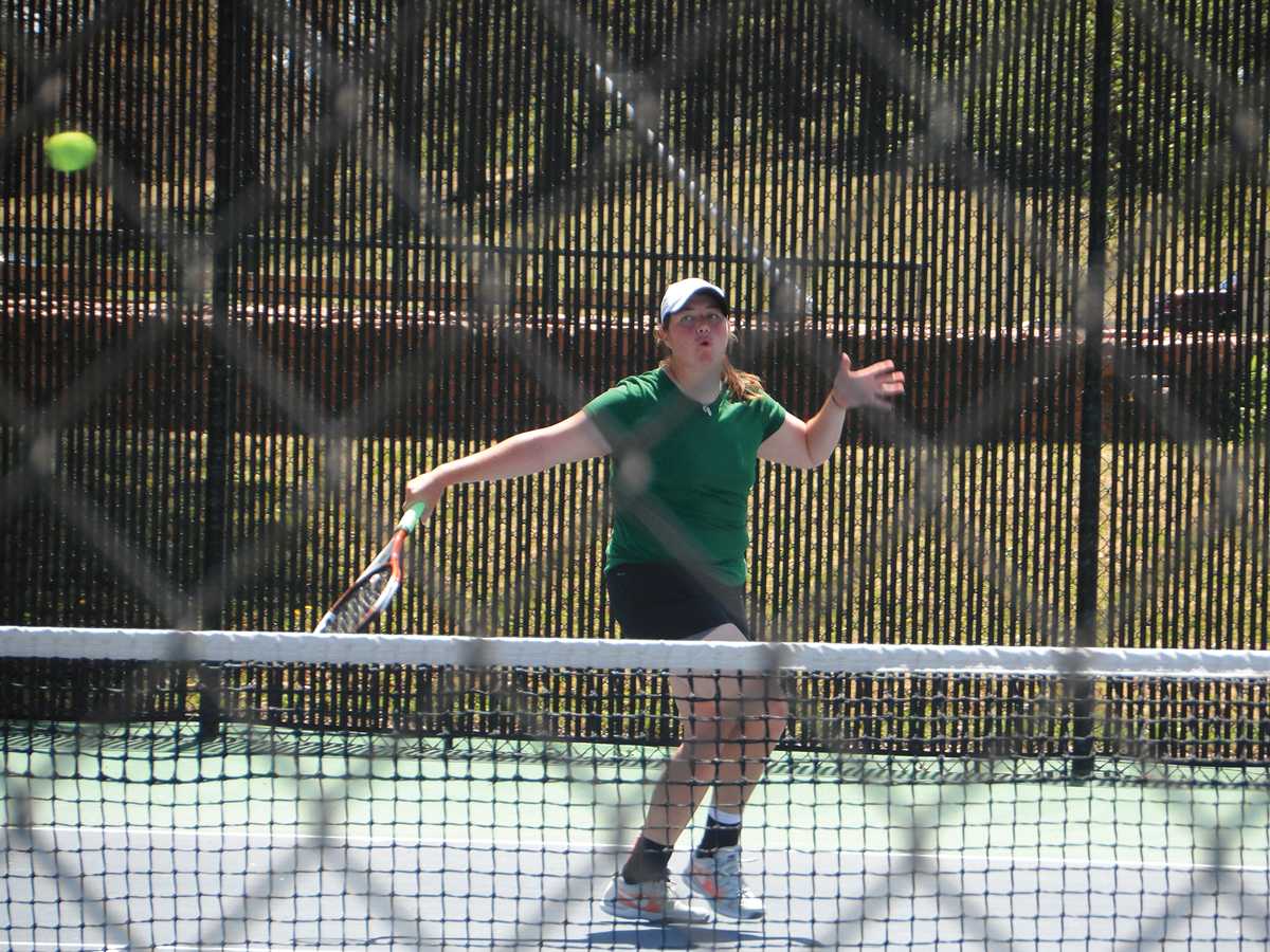 Courtesy photo/ Jackie Arnold
Kathryn Roohan, sophomore and captain for the Lady Saints women’s tennis team serves at a match on Saturday, April 27 in Wichita.