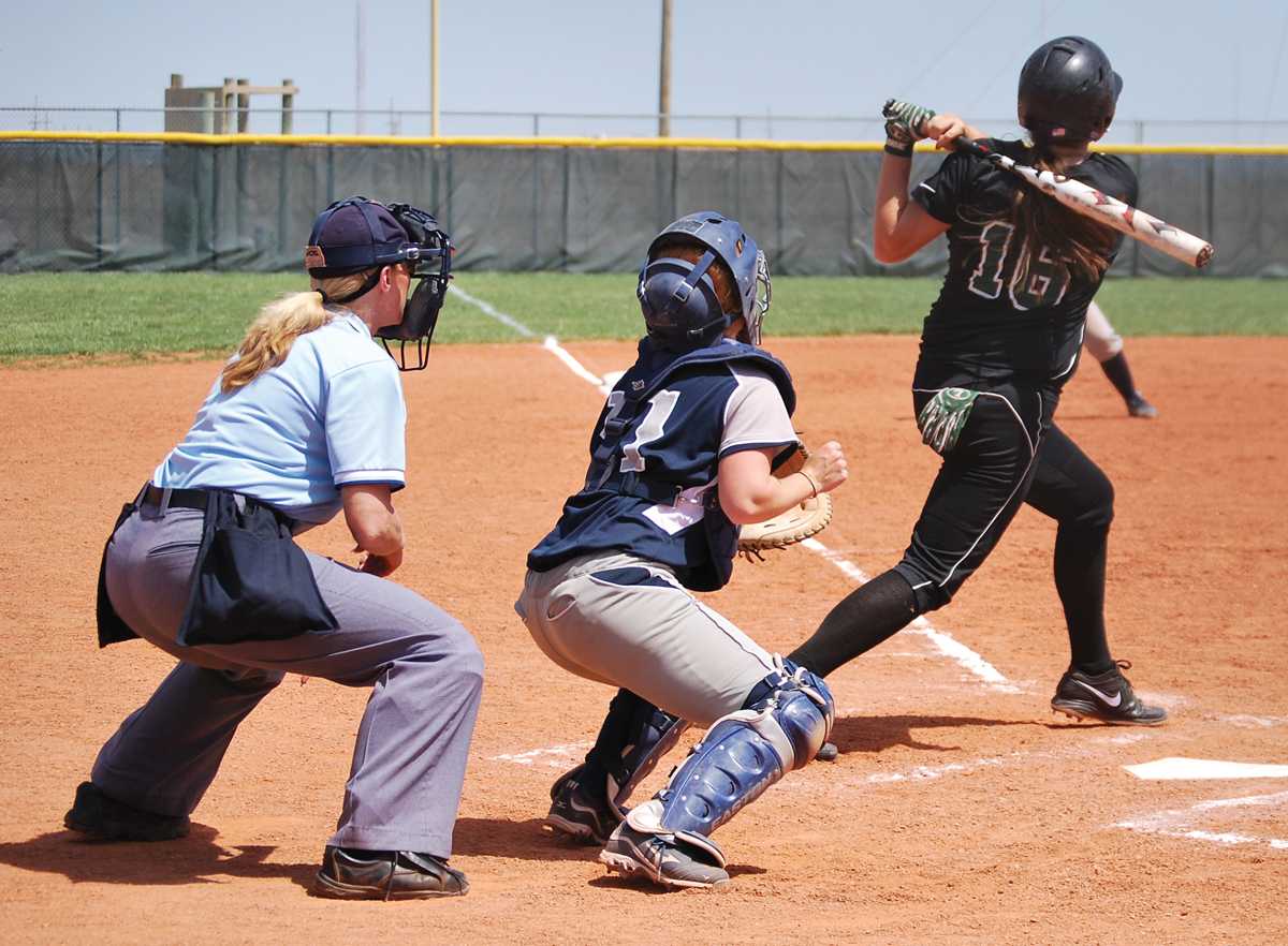 Crusader photo/Jose Medrano
Becky Allen hits a fly ball down the center during the Lady Saints first match against Otero on Sunday. The first game was won 4-3 but they lost the second 9-4. The Lady Saints will begin regional play this weekend.