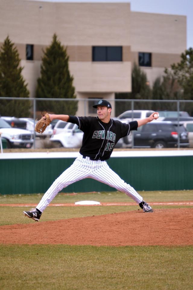 Crusader photo/ Efren Rivero  Hayden Howard pitches on the cold season opener against McCook Community College. Saints have a season record of 3-4 after having an early start to the season. Saints will face Odessa College Saturday.