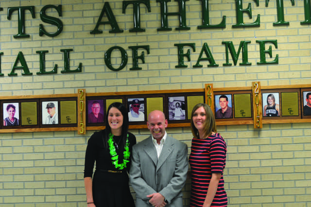 Crusader photo/Diana Chavira Tegan Cunningham, Tim Forkner and Jamie Talbert stand before the Saints Athletics Hall of Fame after unveiling it together for their induction as the Class of 2015.