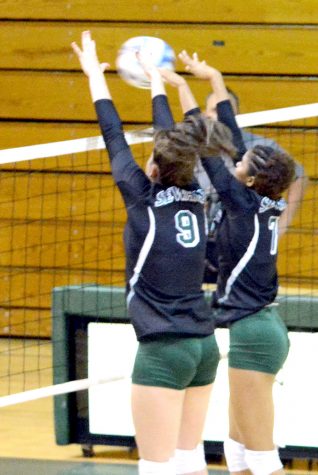 With hands at the ready, Belissa Guidotti, sophomore from Avare, Brazil, and Maritza Mesa, sophomore from Santo Domingo, Dominican Republic, deny the ball from entering the other side of the court.