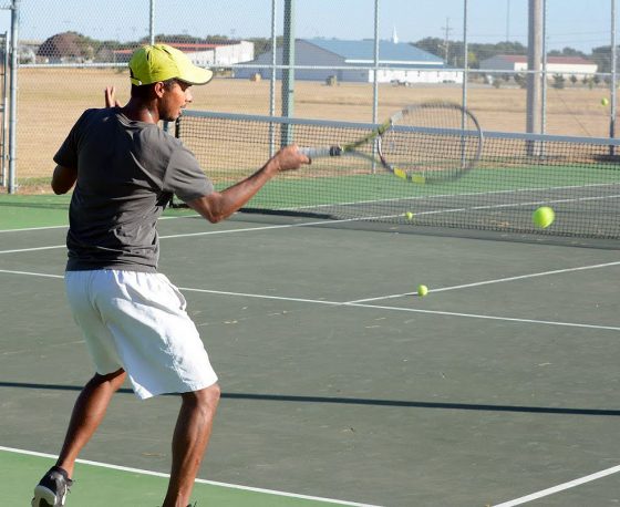 Carlos Añez runs through drills during tennis practice. He and his doubles' partner, Ondrej Nice, will represent SCCC at the NJCAA national tournament this weekend. It's the first time Saints tennis has qualified for this event. Both the men's and women's teams have
