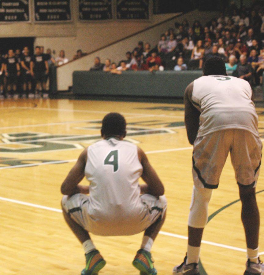 Sophomore players Charles Beauregard and Ernest Carter take a moment to prepare for the upcoming competitions. 