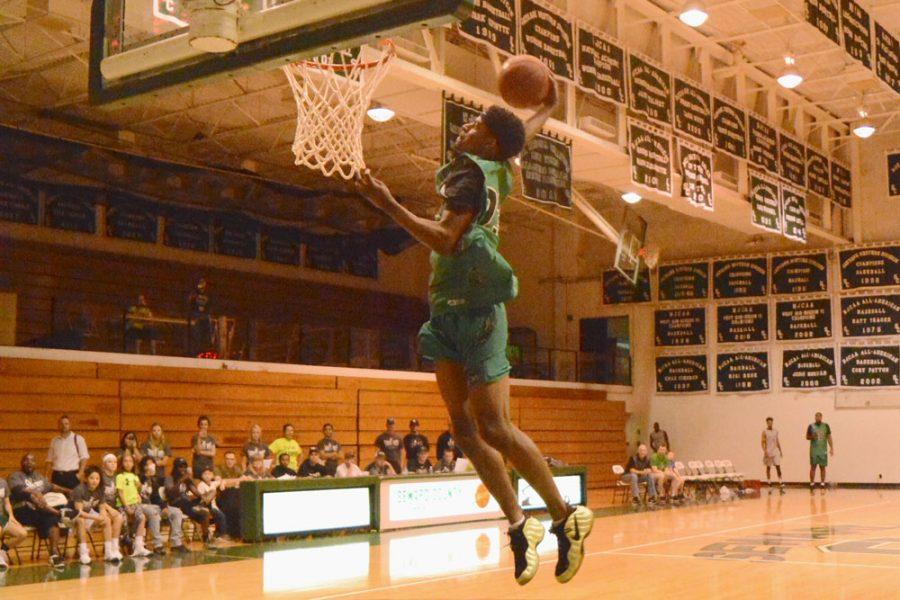 The judges watches in awe as Malik Brown, 6’2 sophomore from Dallas, Texas, lands an impressive dunk. As a senior Brown, averaged 20 points per game and earned All-District honors for the second straight year.