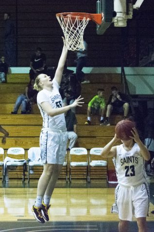 Sophomore Joanna Grymek of Krakow, Poland makes a basket during warm-up.