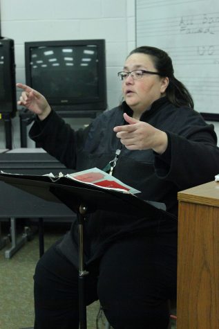 Choir instructor Magda Silva, directs her choir in a song they will be performing for their winter concert. 