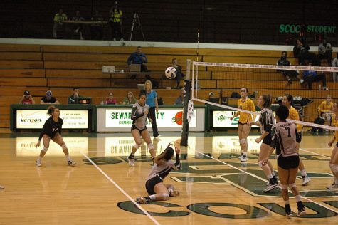 Amanda Pereira (Sophomore) goes for a saving dive as her team members look on. 