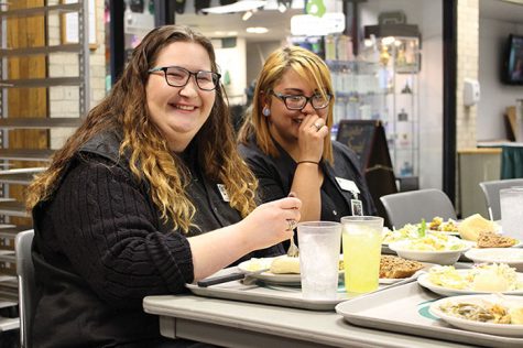 Cosmetology student Meghan McElroy, enjoys a thanksgiving meal with a friend.
