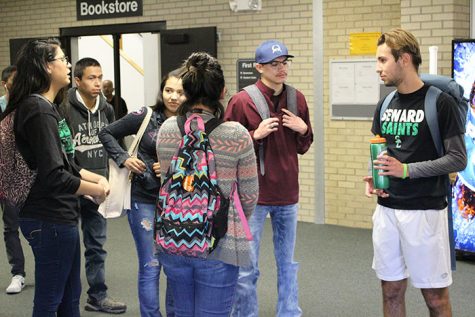 Friends Ramona Lizarraga, Alexis Burciaga, Haydee Amparan and, Baptiste Dutreive wait patiently in line before eating a thanksgiving meal.