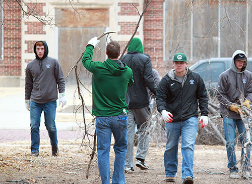 The Seward County Baseball team members help clean up the streets of Liberal after the ice storm.
