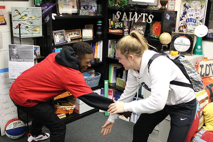 Having chemistry off court is important. Teammates Diamond Bailey and Erin Richardson, pass time by play fighting with one another.  