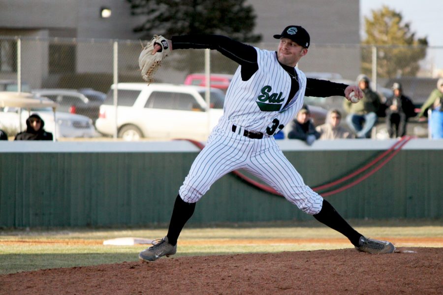 Freshman, Ethan Earhart, pitches against McCook on Saturday. The Saints swept the double-header and jumped out to a 2-0 record.