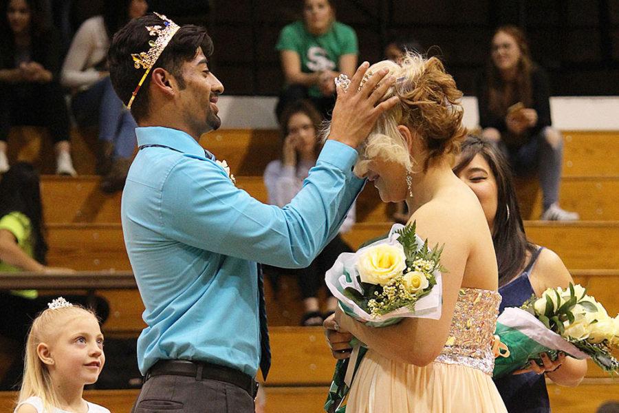 Homecoming King Andy Ortiz crowns Homecoming Queen Myriam Rubio at the ceremony between games, Saturday, Feb. 18 in the Greenhouse.