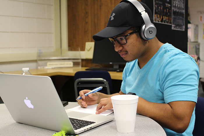 Studying his major in engineering, Jorge Mendoza catches up on his work in the student success center.