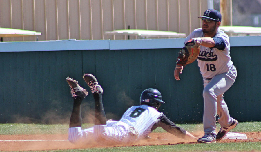 Outfielder Timothy Fitzgerald gets down and dirty with an attempt to make it back to first base. Fitzgerald has managed to get one RBI this season.