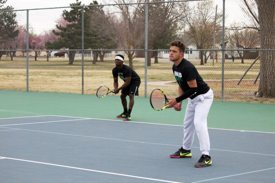 Sophomore Alex Moshele and freshman Gabriel Nery get ready to receive the ball against their opponents Colorado State. Moshele took a straight sets win at #2.