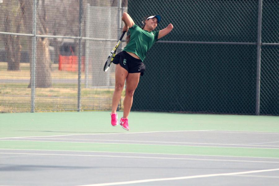 Sophomore Thalita Rodrigues powers up for a serve. Rodrigues had a great first season in Liberal for the Lady Saints winning Region VI Championships in both singles and doubles while placing in the top five at the NJCAA National Tournament in both as well.