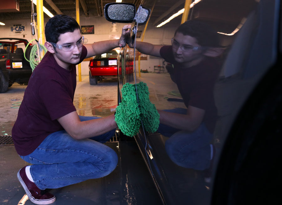 Miguel+Fernandez%2C+freshman+auto+body+collision+repair%2C+finishes+cleaning+a+car+by+wiping+off+the+excess+water.+The+Auto+Body+Collision+Repair+students+are+detailing+cars+as+a+fundraiser.+The+students+are+raising+money+to+attend+a+competition+in+Las+Vegas.