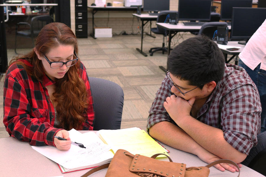 Isabella Russell receives help from her tutor, Jose Cardenas, on trigonometry homework. “It’s a really good class. I really enjoy having Heather [Hannah] as a teacher but I just struggle learning trigonometry,” said Russell. 
