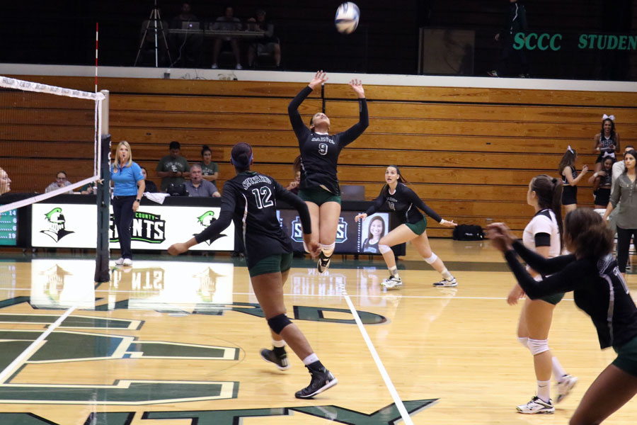 Esmadar Tavares prepares to set the ball to Giovanna Tapigliani. The Lady Saints remain undefeated on their home court.
