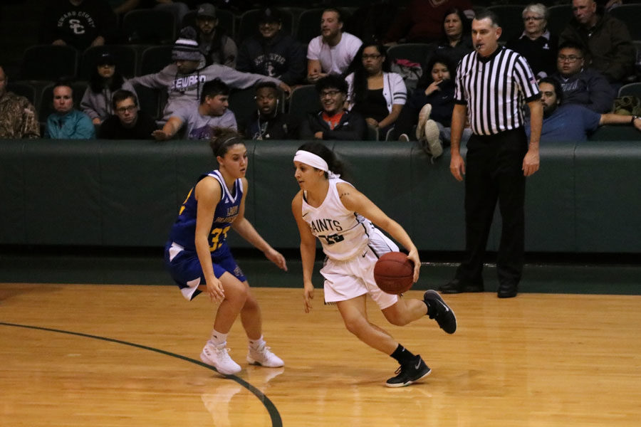 Sophomore Vanessa Caro dribbles past her opponent to make an easy lay up. Vanessa scored 12 points against Frank Phillips College. 
