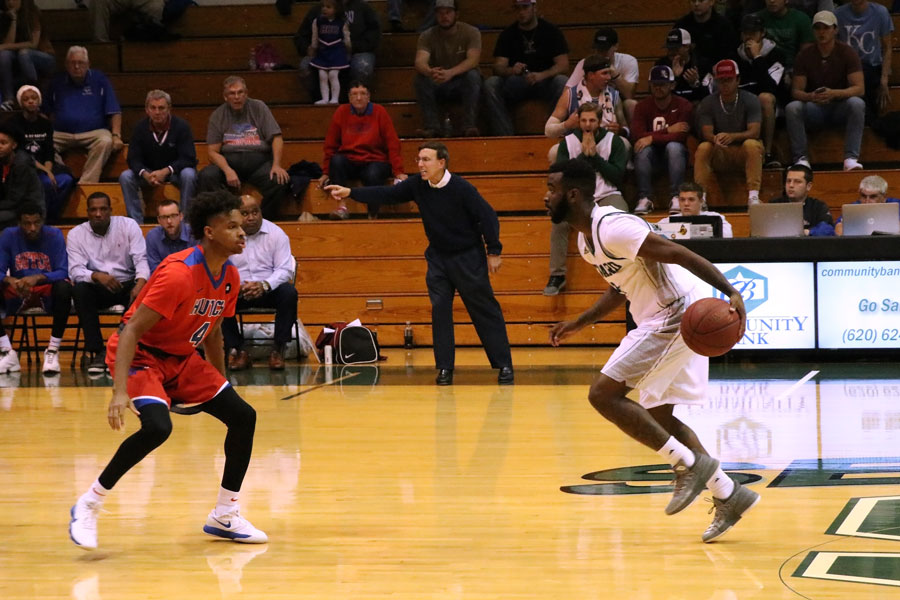 Freshman Devin Bethely attempts to cross his opponent. Bethely scored more than 20 points against the Hutchinson Blue Dragons.