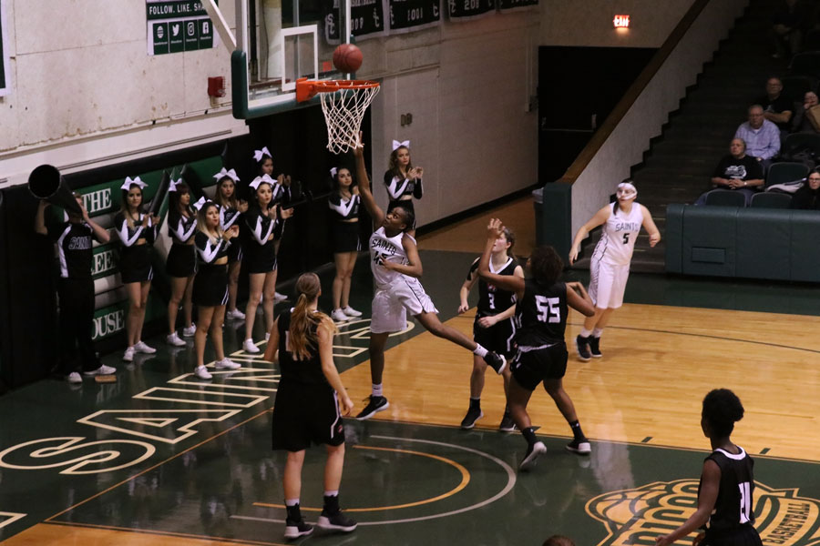 Freshman Vilma Covane finishes at the basket after posting up her opponent. Vilma Covane scored 11 points against Cowley Community College.