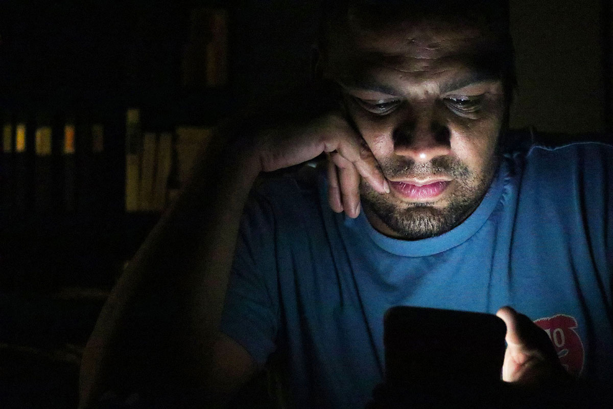 David Quiroz, freshman art major, looks through an app on his phone during Photography class. It was part of the in-class assignment but he openly admits to pulling his phone out and using it, even when it’s not allowed.
