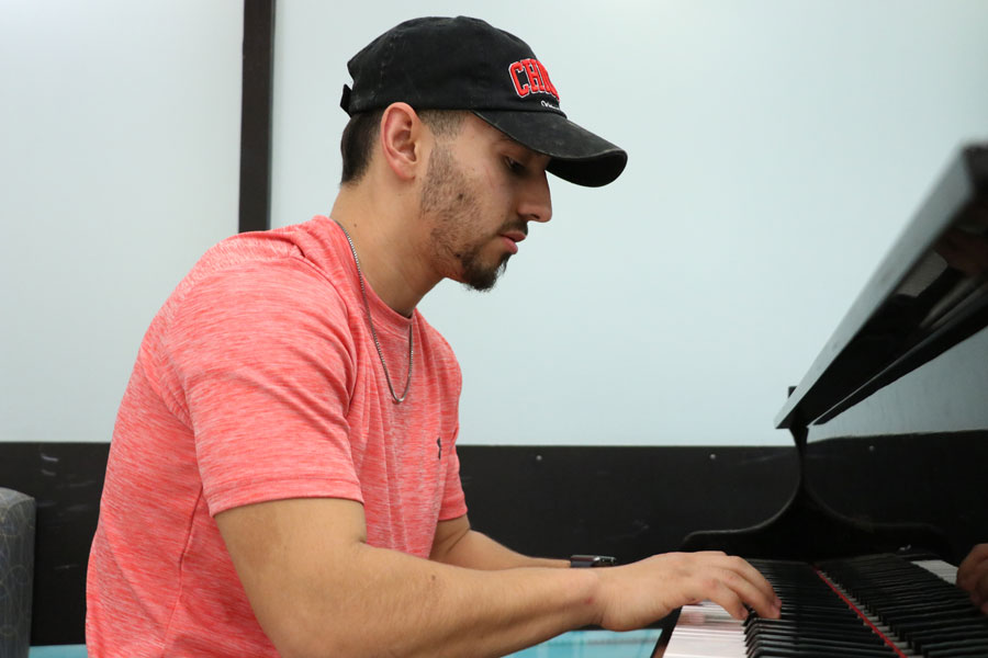 Sophomore Sergio Peregrino enjoys playing the piano before and after classes. Peregrino knows how to play the drums, the guitar and the piano.
