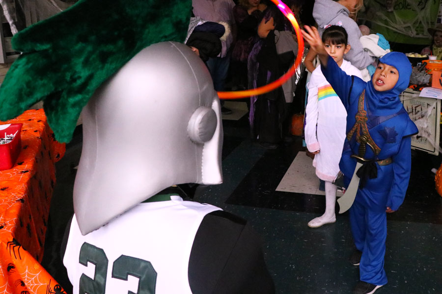 The SCCC cheer squad had a game where the kids had a chance to toss a hula hoop on SCCC mascot, Louie. After attempting to toss the hula hoop, they also had the opportunity to snap a picture with Louie.