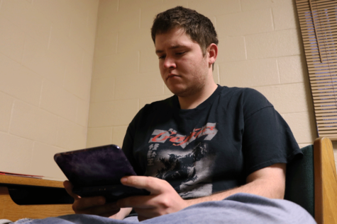 Freshman Matthew Schmitt enjoys playing his Nintendo DS when he is not working on homework.