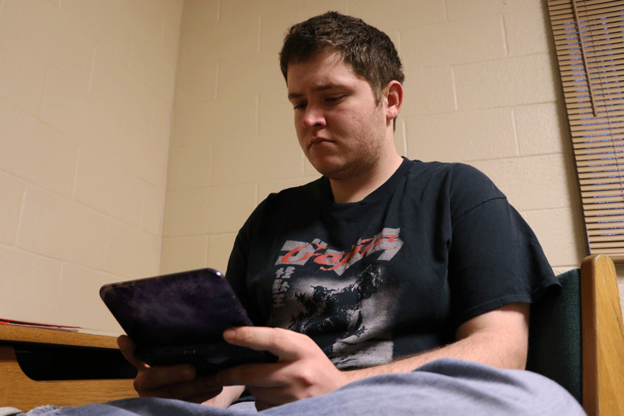 Freshman Matthew Schmitt enjoys playing his Nintendo DS when he is not working on homework. 