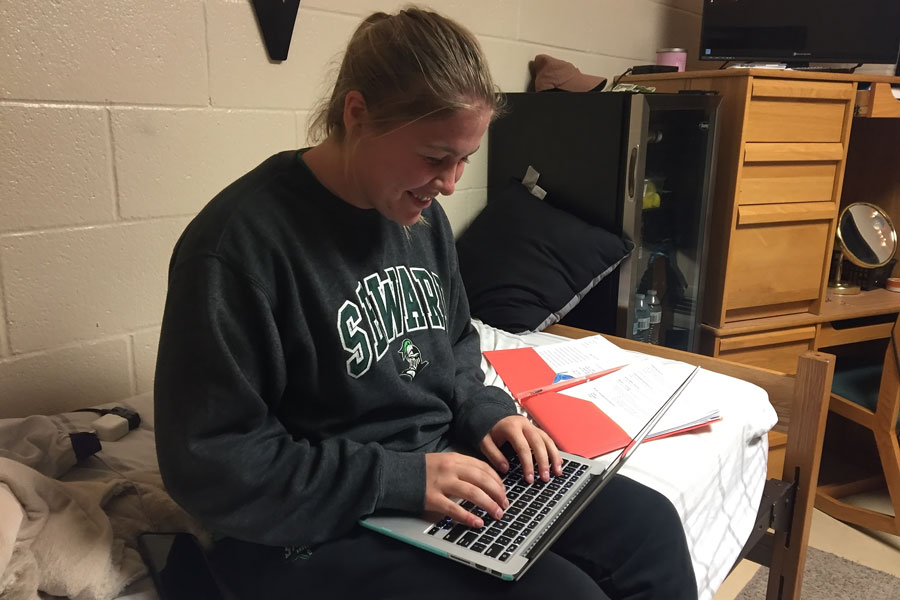 Mollie Mounsey working on her homework. Mounsey is an excellent and very involved student in the classroom.