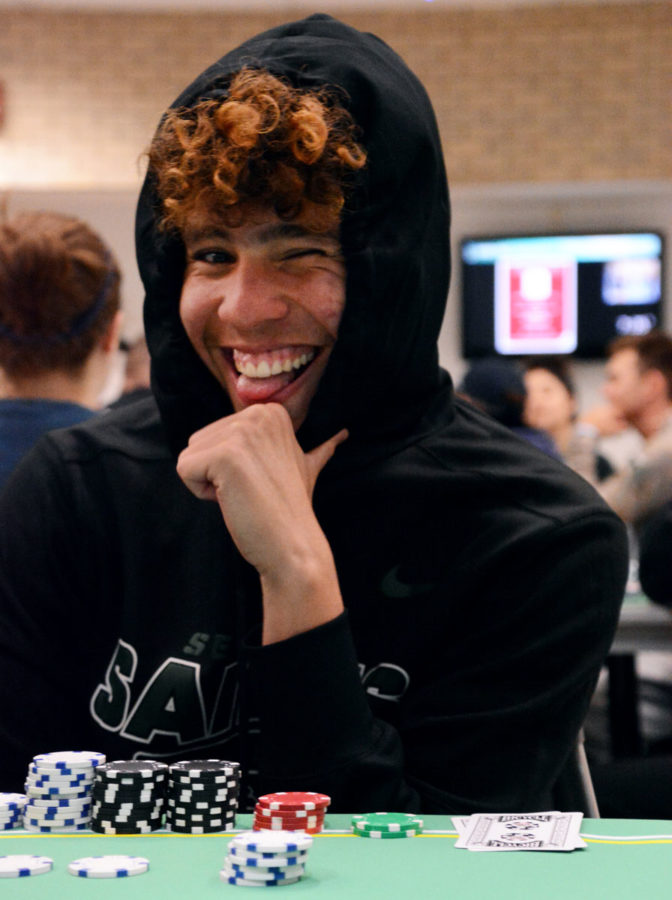 Jafer Infante, freshman, laughs as he decides how to bet on his bad hand of cards. SCCC’s student government association sponsored the event to bring students who live on and off campus together for fun and a chance to hang out.