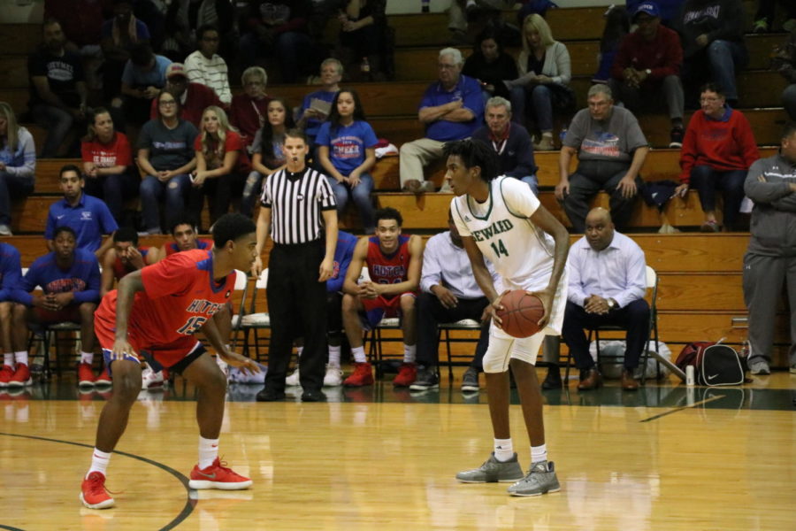 Small tries to look for an open teammate during the first half against the Hutchinson Blue Dragons. The Saints fell short to beat the Blue Dragons. Small finished the game with a total of 12 points. 