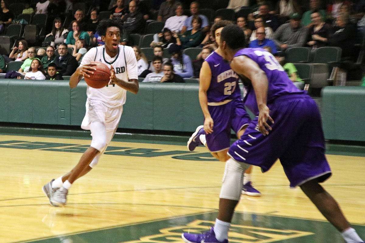Isiah Small , freshman forward, drives the basket on a fast break in a home game earlier in the season. The Saints secured a home game in post season playoffs with a win over Dodge City Community College Feb. 24. (File Photo)
