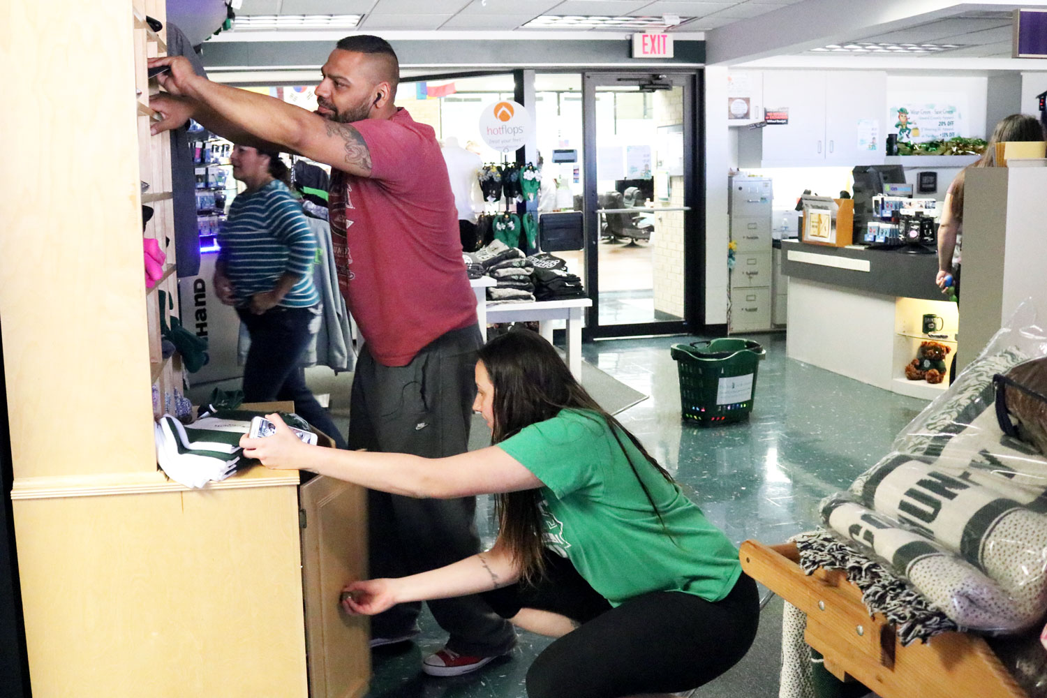Colvin Adult Learning Center student, David Quiroz and Sophomore, Giovanna Tapigliani, search everywhere for more eggs. There were over 500 dollars worth of prizes being given out for the students who found eggs.