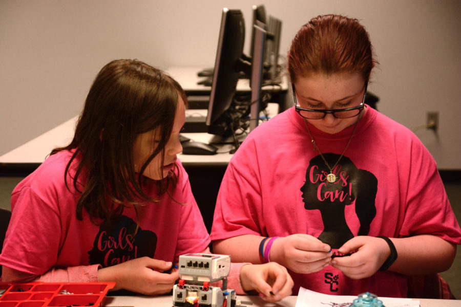 Fourth grader, Jordyn Sautter and sixth grader, Kaitlyn Thompson learn to build and program a robot during the Women in Robotics class.