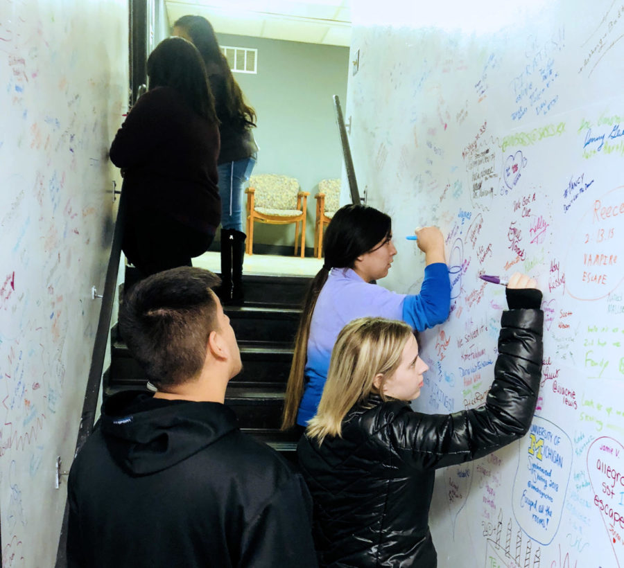 After escaping the escape room, Crusader staff members were able to sign the walls for their accomplishment.
