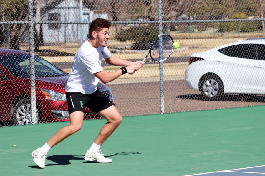 Rousset volleys with an opponent from Southeastern Oklahoma State in the number one spot. (File Photo)
