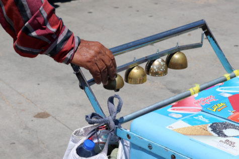 A paleteros hands are never far from the bells that call out to customers. Liberal has a long tradition with selling Mexican ice cream from a push cart, just like in Mexico.