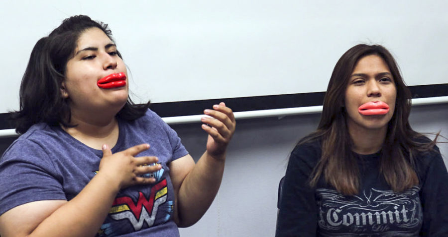 Michelle Mattich and Alondra Botello try to talk with silicone lips. (Compete Fail)