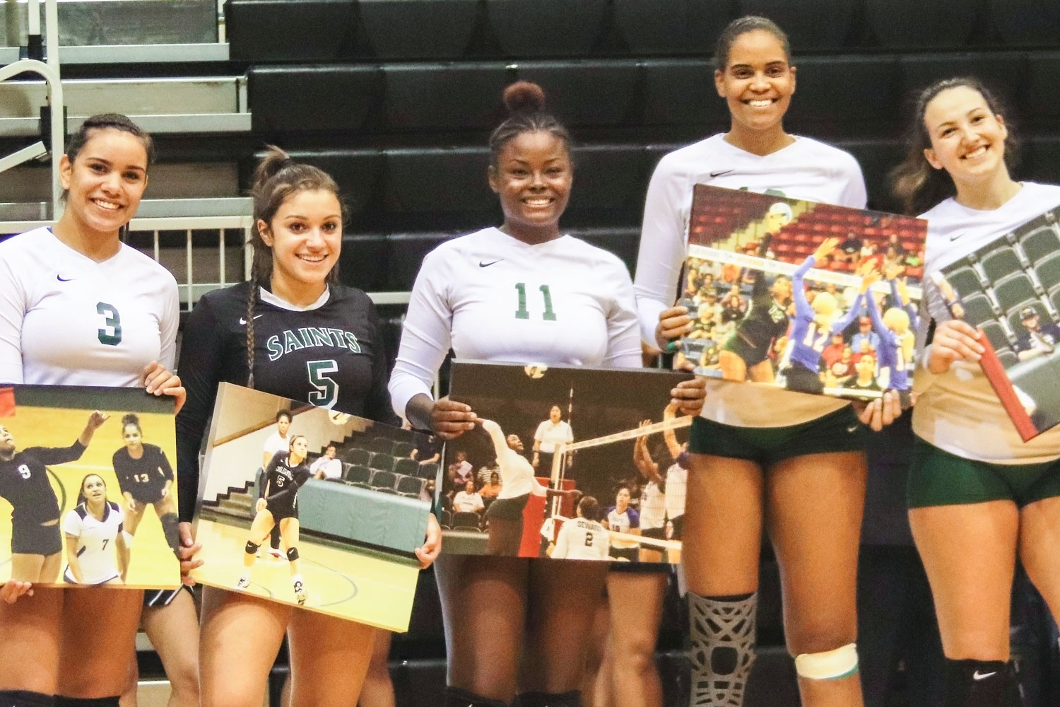Setter, Esmadar Tavares; libero, Nathiellen Machado; middle/outside hitter, Aundrea Boyland; middle hitter, Luz Sierra and right side hitter, Giovanna Tapigliani pose for their picture on Sophomore Night. Sophomore Night honors players as they play their final season as Seward County Lady Saints.